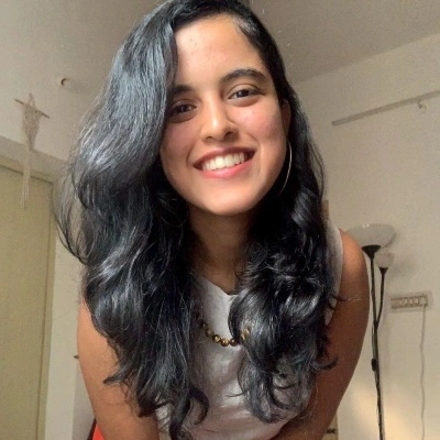profile photo of woman smiling and leaning into camera
